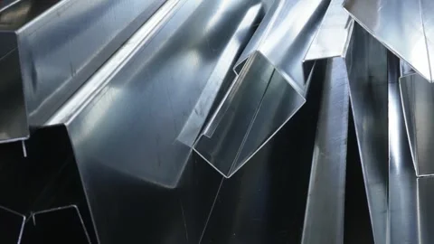 A stack of galvanized steel profiles, manufactured on a press brake. Stock Footage 331157590