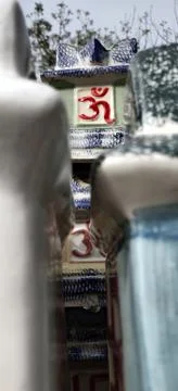 Stack of garden porcelain pots with aum written in red Stock Photos