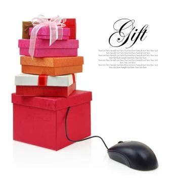 Stack of gift boxes connected to a computer mouse Stock Photos
