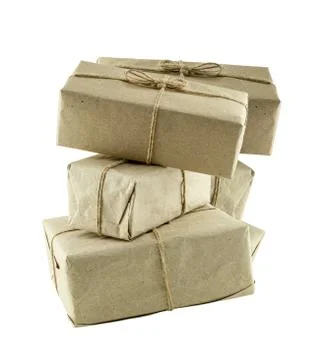 Stack of giftbox in brown craft paper with twine on a white isolated backgrou 스톡 사진