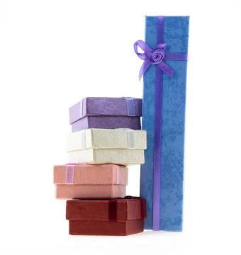 Stack of giftbox square red, pink and long gift blue on an isolated backgroun Foto stock