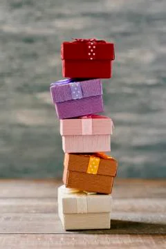 Stack of gifts on a wooden surface Stockfoto's