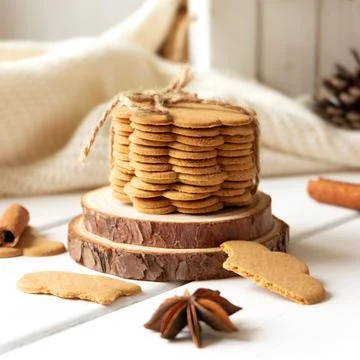 Stack of ginger cookies and spices on wooden tabletop Stock-Fotos
