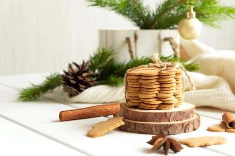 Stack of ginger cookies and spices on wooden tabletop Stock Photos