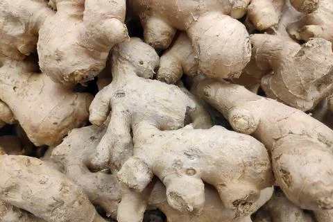 Stack of ginger on a market stall Stock Photos