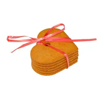 Stack of gingerbread cookies tied with red ribbon isolated on white backgroun Stock Photos