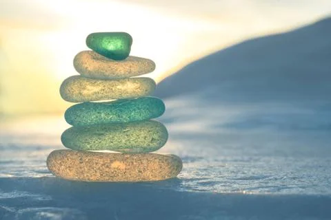 Stack of glass pebble on sunset Stock Photos
