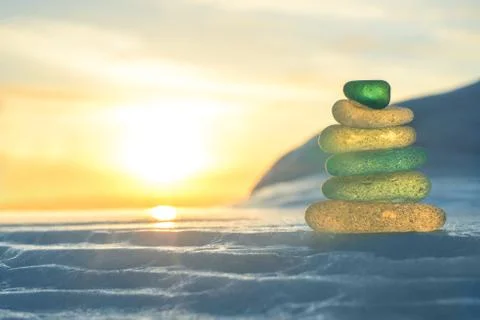 Stack of glass pebble on sunset Stock Photos