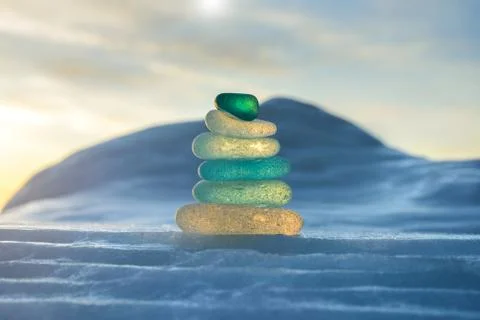 Stack of glass pebble on sunset Stock Photos