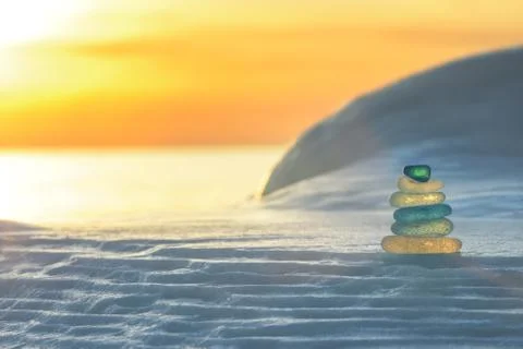 Stack of glass pebble on sunset Stock Photos