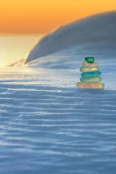 Stack of glass pebble on sunset Stock Photos