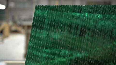 Stack of glass sheets cut to exact same size stacked in a row in glass Stock Footage 124001493