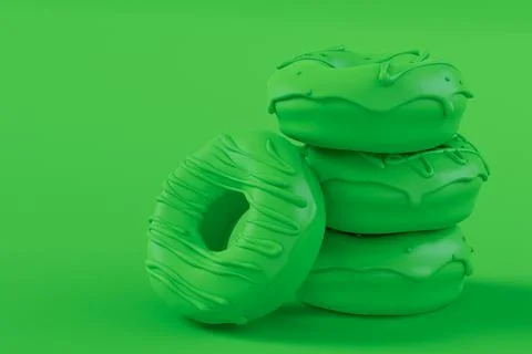 Stack of glazed donut with sprinkles on plain monochrome green color Foto stock