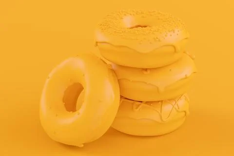 Stack of glazed donut with sprinkles on plain monochrome yellow color Stock Photos