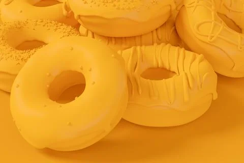 Stack of glazed donut with sprinkles on plain monochrome yellow color Stock Photos