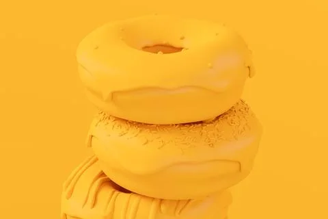 Stack of glazed donut with sprinkles on plain monochrome yellow color Foto stock