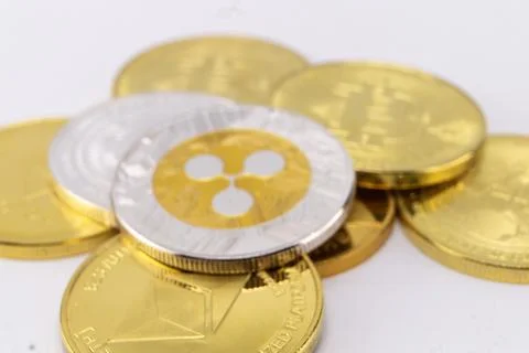 Stack of Gold and Silver Cryptocurrency Coins Featuring Ripple Logo on Whit.. 写真素材