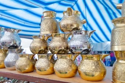 Stack of gold and silver pitchers Stock Photos