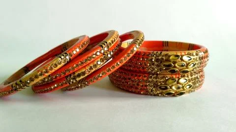 Stack of gold bangle with vivid color and rhinestone isolated on white backgr Stock Photos