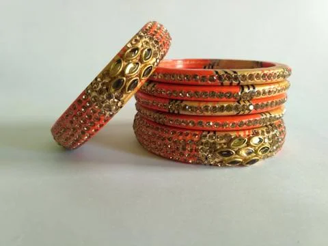 Stack of gold bangle with vivid color and rhinestone isolated on white backgr Stock Photos