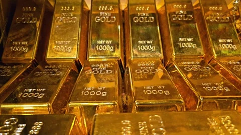 Stack of gold bars with 1000g weight markings. Close-up view of multiple bricks Stock Footage 310851466