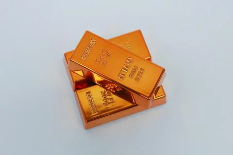 Stack of gold bars shining on a white background Stock Photos