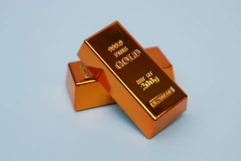 Stack of gold bars shining on a white background Stock Photos