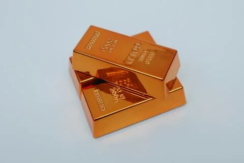 Stack of gold bars shining on a white background Stock Photos