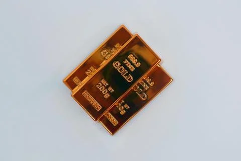 Stack of gold bars shining on a white background Stock Photos