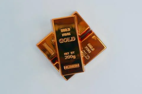 Stack of gold bars shining on a white background Stock Photos