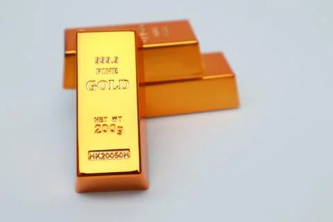 Stack of gold bars shining on a white background Stock Photos