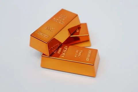 Stack of gold bars shining on a white background Stock Photos