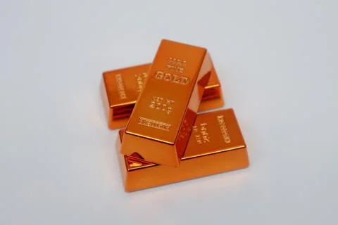 Stack of gold bars shining on a white background Stock Photos