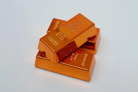 Stack of gold bars shining on a white background Stock Photos