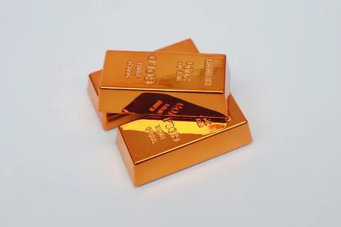 Stack of gold bars shining on a white background Stock Photos