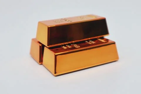 Stack of gold bars shining on a white background Stock Photos