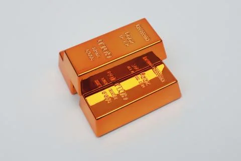 Stack of gold bars shining on a white background Stock Photos