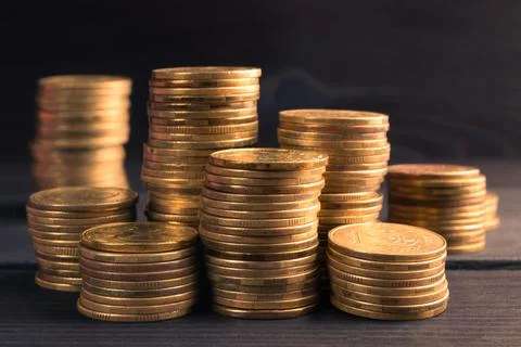 Stack of Gold Coin on Black Background. Foto stock