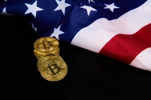 Stack of gold coins with b and american flag beside Stock Photos