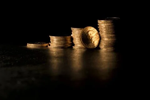 Stack Of Gold Coins Over Black Background. Stock image. Stock Photos