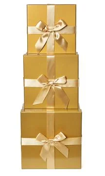 Stack of Gold Gift Boxes over Isolated White. Christmas Presents with Bow 스톡 사진