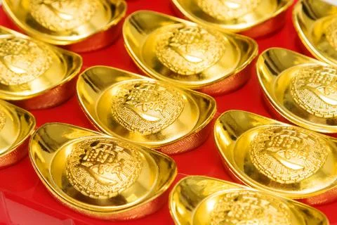 Stack of gold ingots and Blessing word. Stock Photos