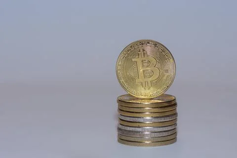 Stack of gold valueable bitcoins crypto currency with gray Stock Photos