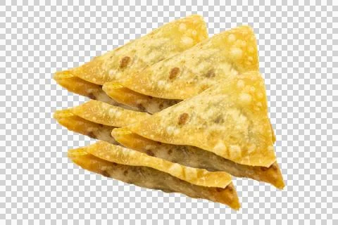 Stack of golden brown, crispy fried triangle-shaped samosas or wontons. Stock Photos