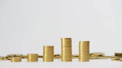 Stack of golden coin on table background and business or finance saving money Video stock 334027982