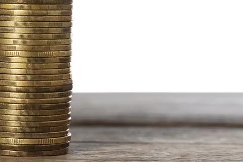Stack of golden coins on wooden table, space for text 스톡 사진