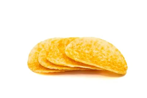 Stack of golden crispy tortilla chips isolated on white background for snack Stock Photos