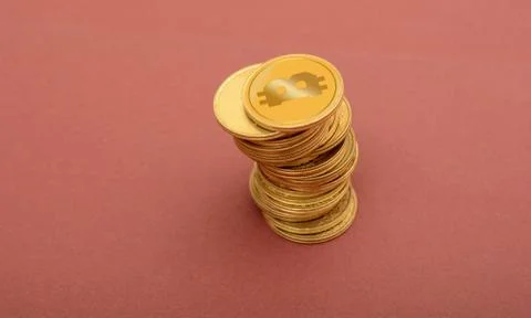 Stack of Golden CryptoCurrency Bitcoin on Red background Stock Photos