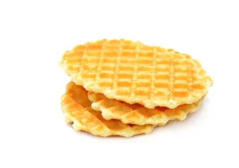 A stack of golden round waffles isolated on white background Stock Photos