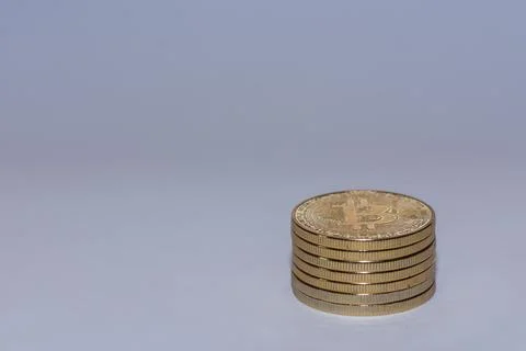 Stack of golden valueable bitcoins from crypto currency with gray Stock Photos